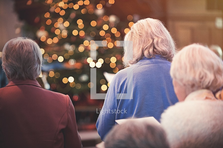 congregation singing hymns at a Christmas worship service 