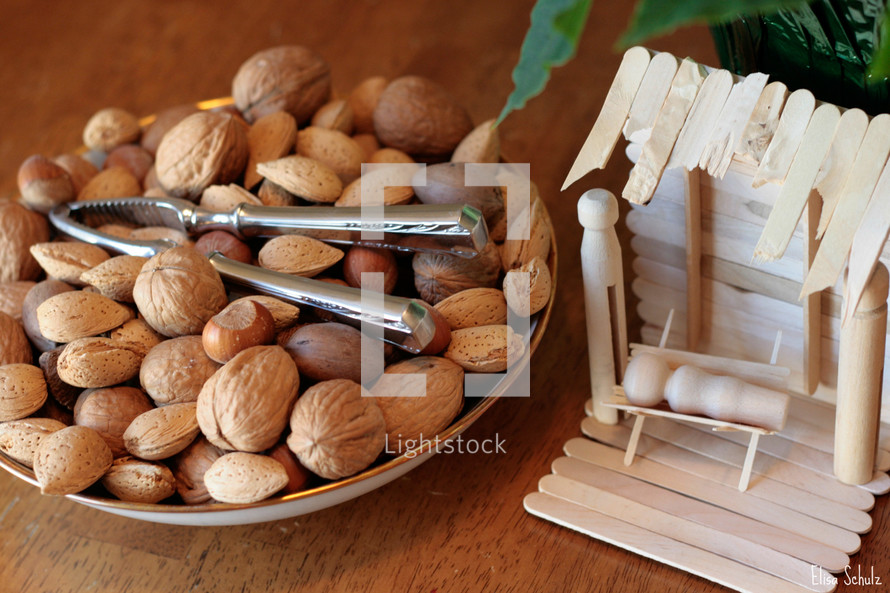 bowl of walnuts and manger scene 