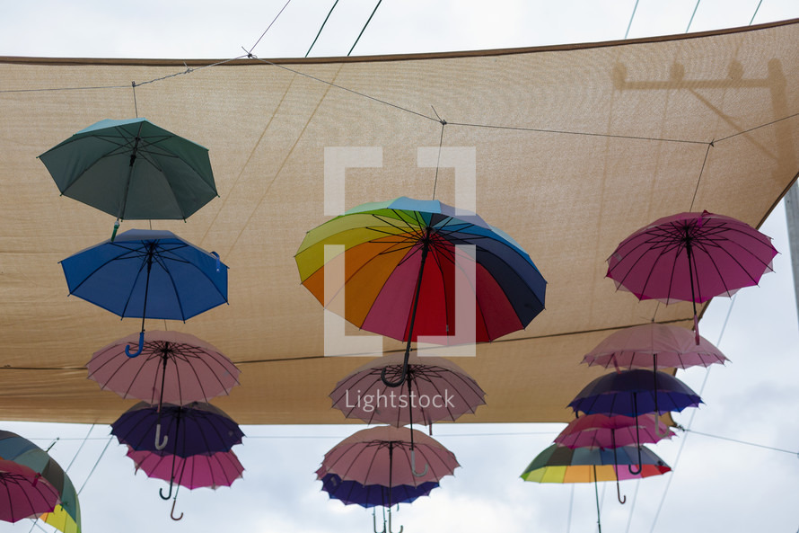 colorful umbrellas under a sunshade 