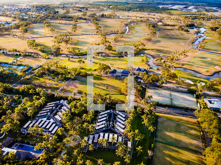 aerial view over condos and golf course 