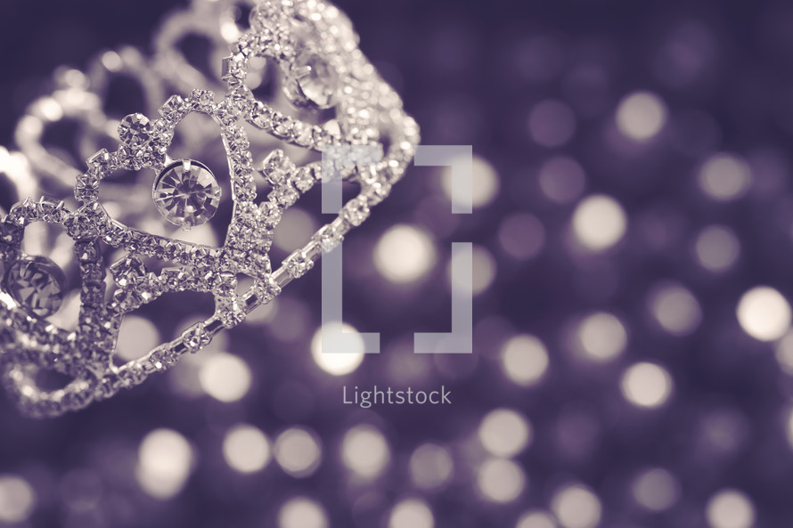 crown and purple bokeh background 