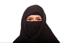 a Muslim woman in a niqab smiling 