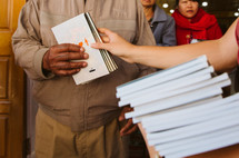 passing out pamphlets during a mission trip 