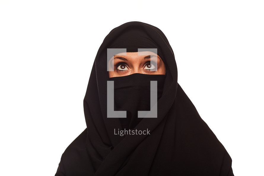 A Muslim woman looking up 