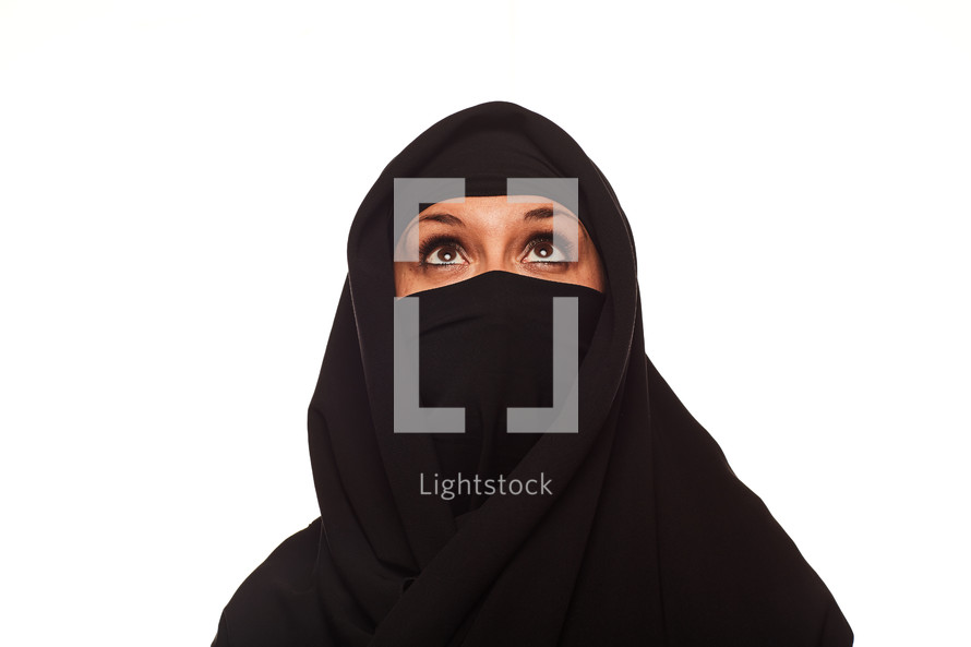 A Muslim woman looking up 