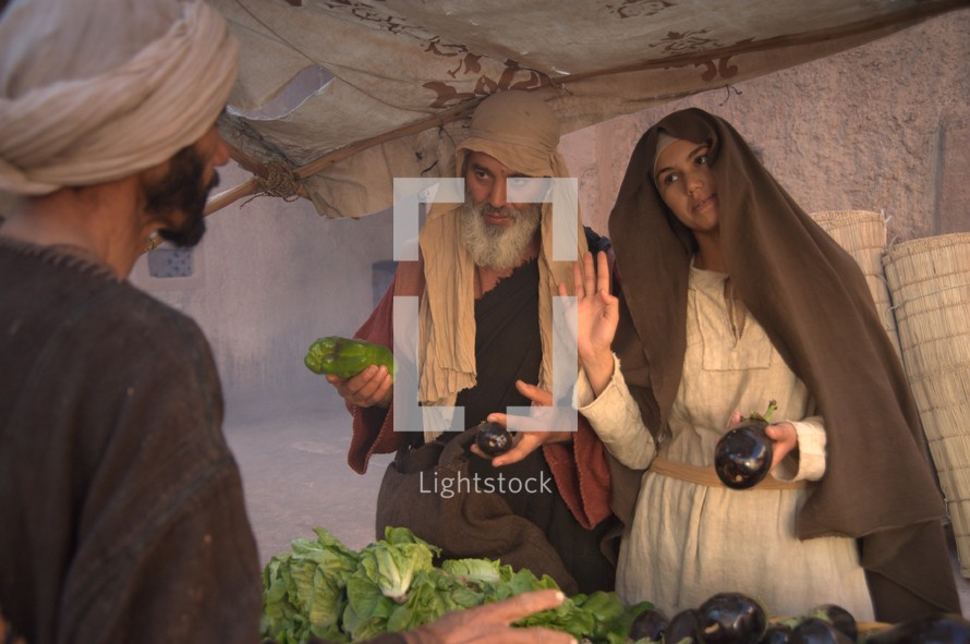 people at a vendor in a market in biblical times 