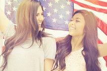 friendship between young women under an American flag