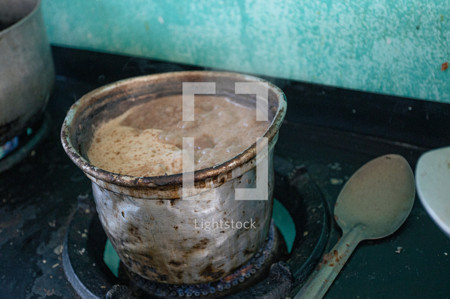 food cooking on a stove in a third world country 