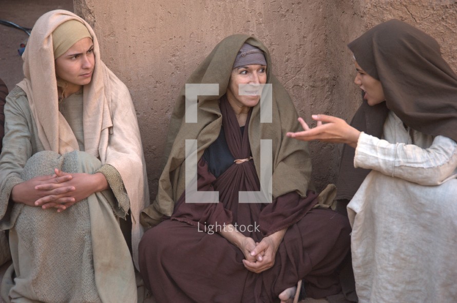 women talking in a village in biblical times 