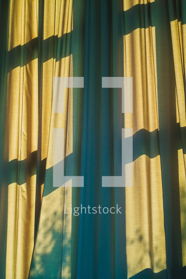 cross shadows on curtains 