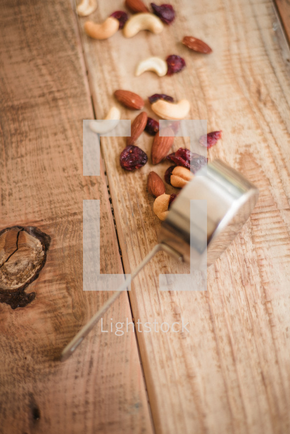 measuring cup of mixed nuts 