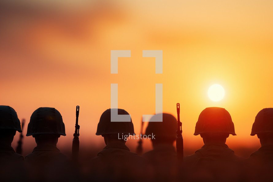 Veterans Day tribute featuring silhouetted soldiers at sunset, honoring military service and sacrifice with a warm, reflective scene.