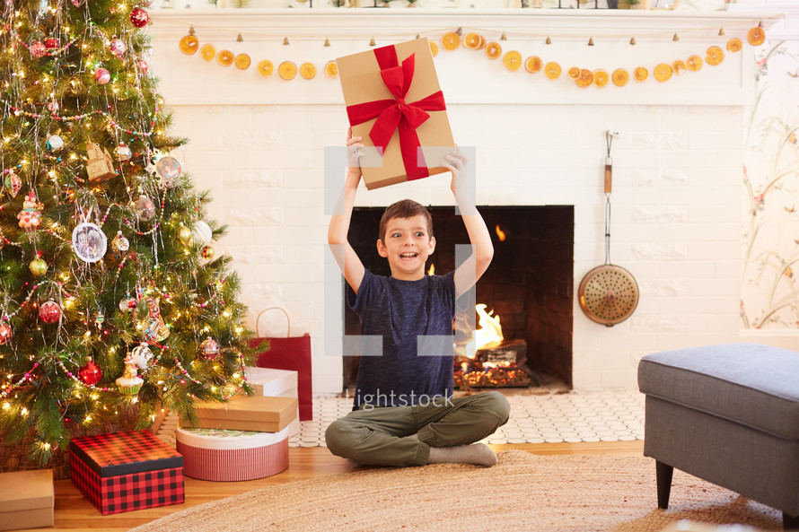 child opening a Christmas present 