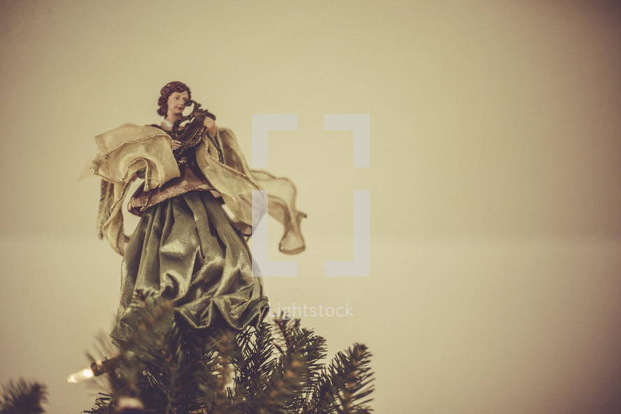 Angel on the top of Christmas tree. 