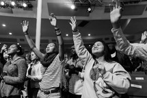 teens praising God at a rally 