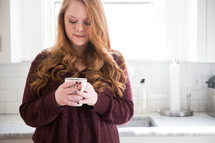 woman in thought holding a mug of coffee
