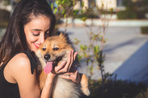 woman hugging dog with copy space for text