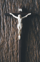 Crucifix on a wooden background