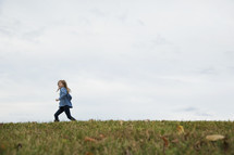 a child running outdoors 