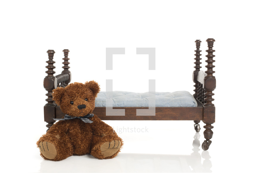 teddy bear and doll bed 
