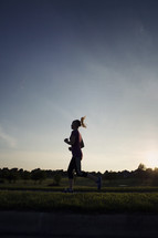 woman jogging at sunset 