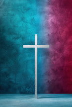 Minimalist white cross against a vibrant, textured background blending blue and purple tones, symbolizing faith and spirituality in a modern, abstract composition.