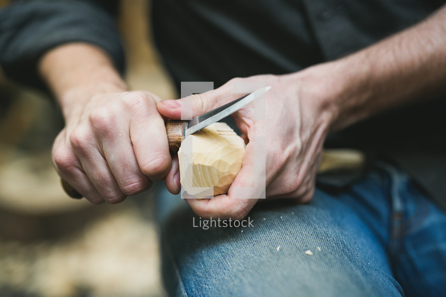 a man carving wood 