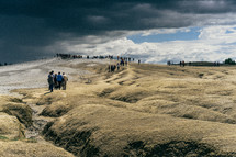 people exploring dunes 