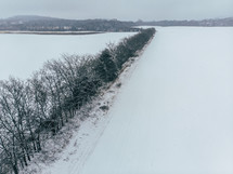 aerial view over a and snow covered landscape 