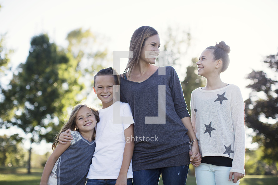 portrait of a family standing together outdoors 