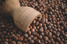 Hazelnuts in a wooden bowl on rustic background