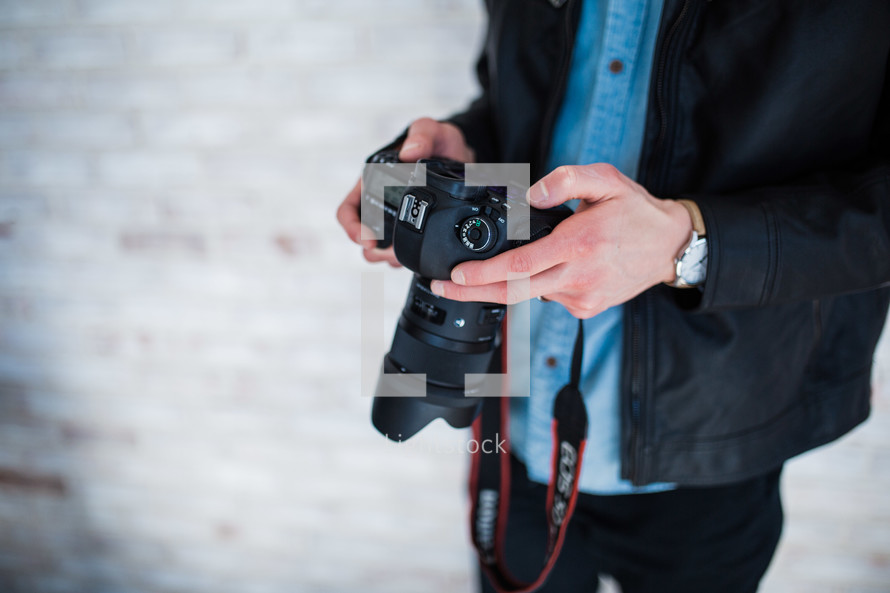 a man holding a camera 