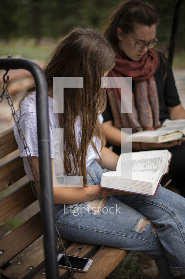 teen girls reading Bibles 