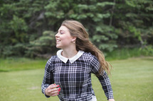 young woman running outdoors 