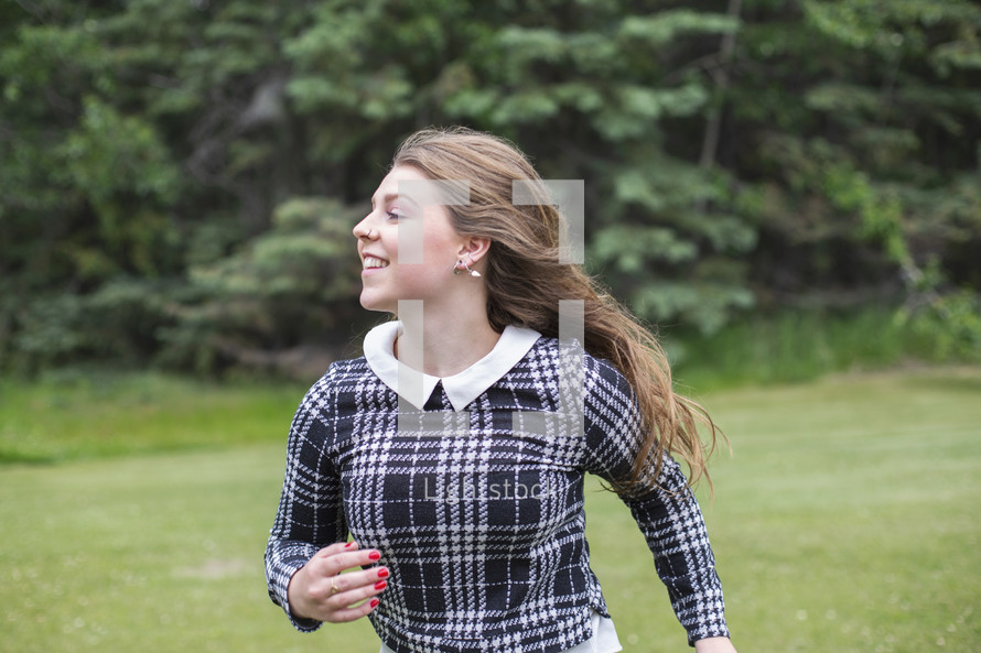 young woman running outdoors 