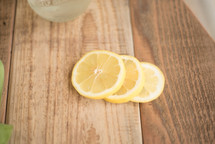 lemon slices on wood countertop