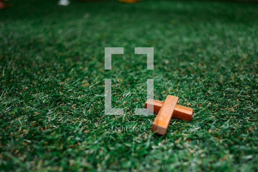 small cross on grass
