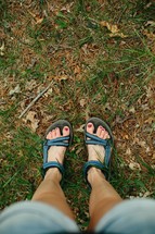 a woman's feet in sandals 