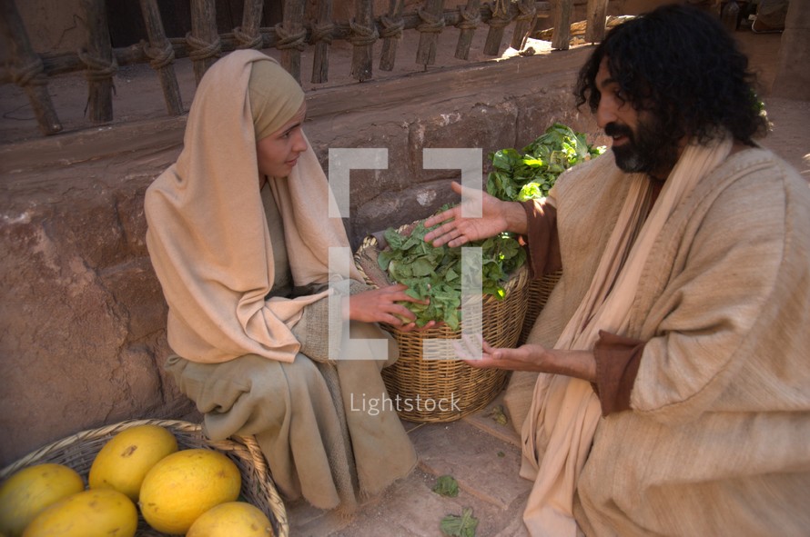 Jesus talking to a woman in the market 
