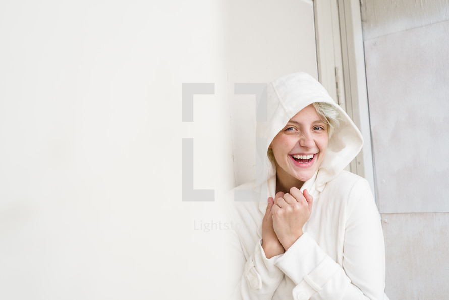 a woman in a white hoodie 