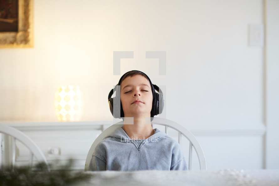 boy listening to headphones