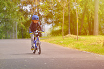 active boy on a bike wearing a helmet 