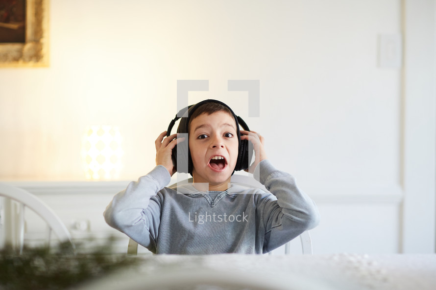 excited boy with headphones 