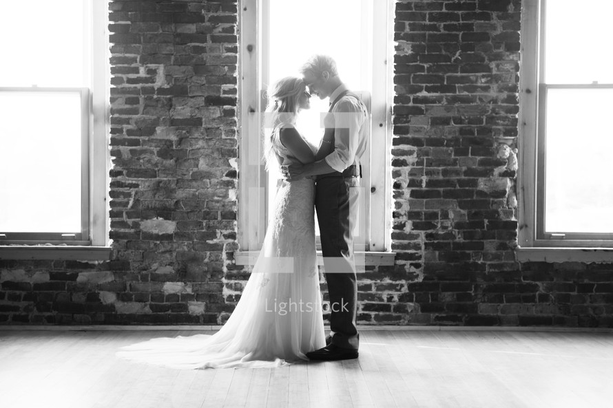 bride and groom hugging in a portrait 