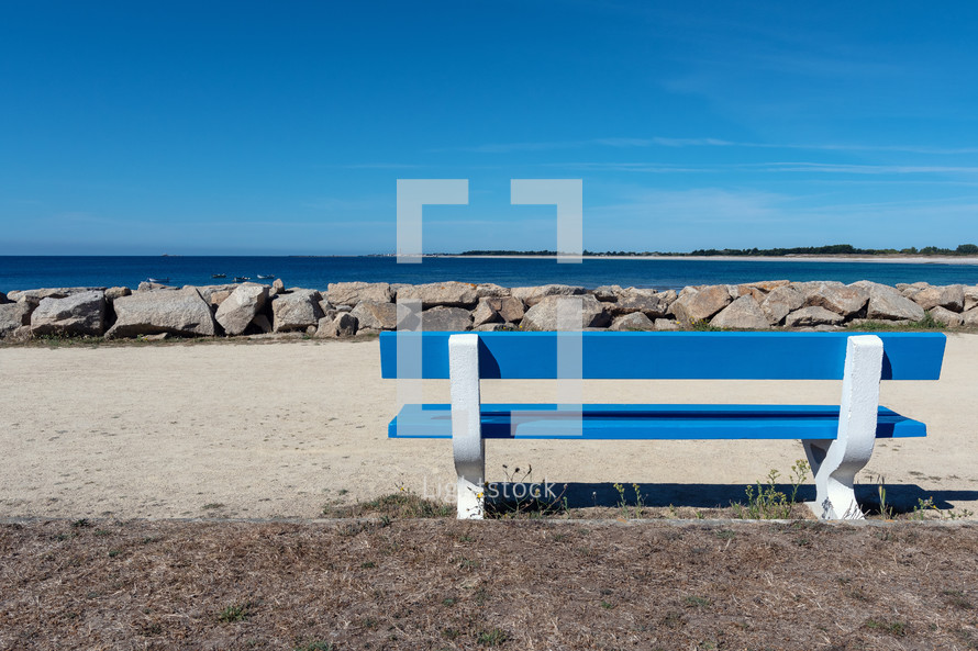 bench by a shore 