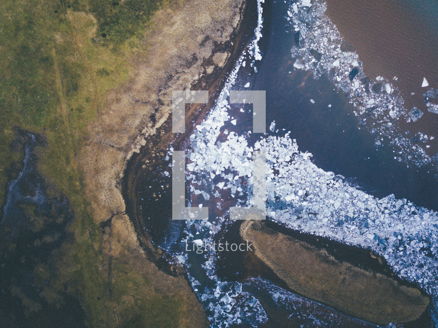 aerial view over an icy lake 