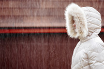 a woman in a puffy coat 