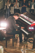 a man playing a piano for worship music 