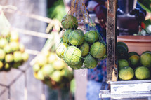 Bag of limes at a fruit stand in Kolkata, India.