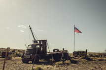 American flag in a salvage yard.
